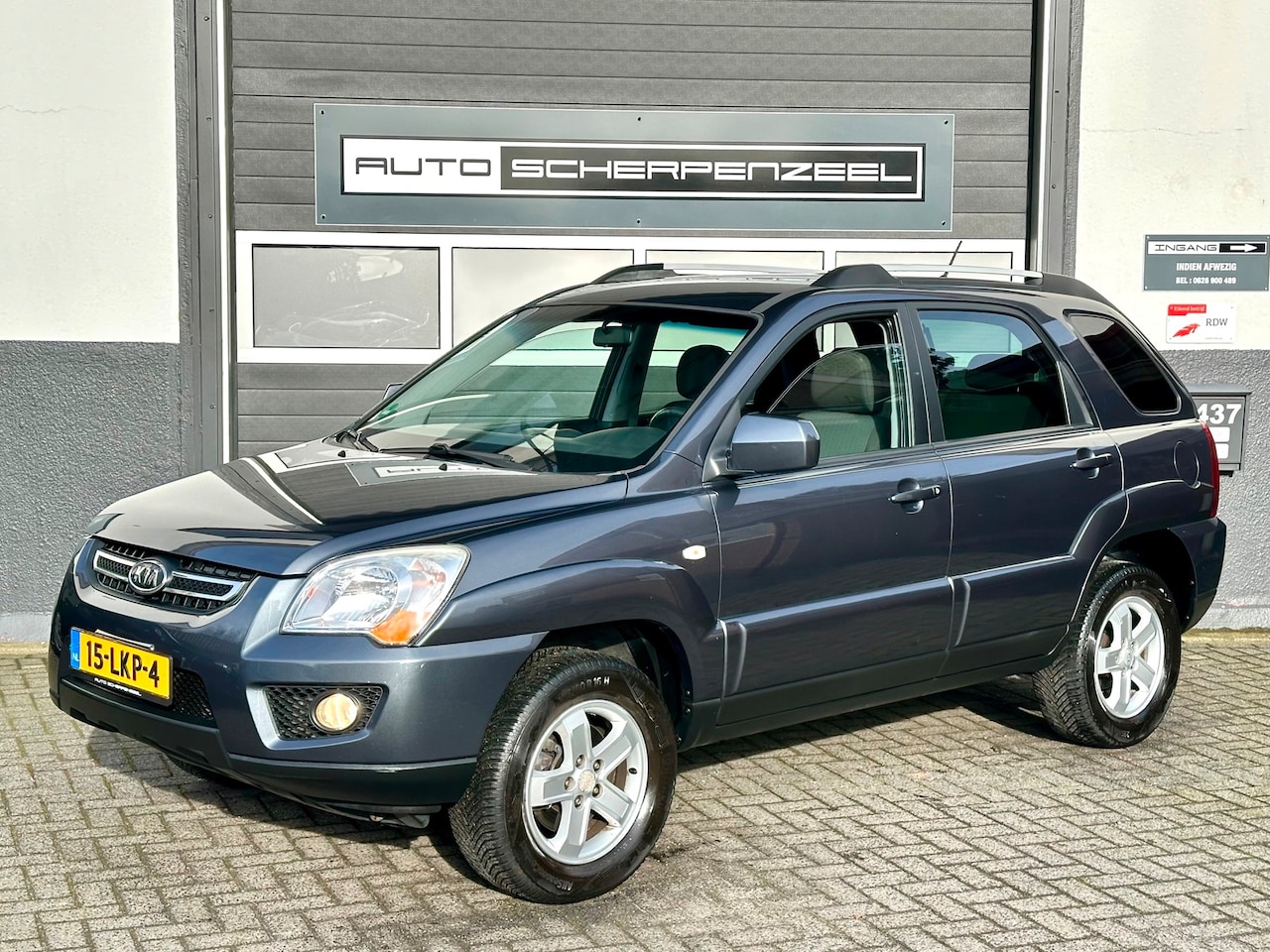 Kia Sportage - 2.0 CVVT X-tra | AIRCO | CRUISE | TREKHAAK | NL AUTO - AutoWereld.nl
