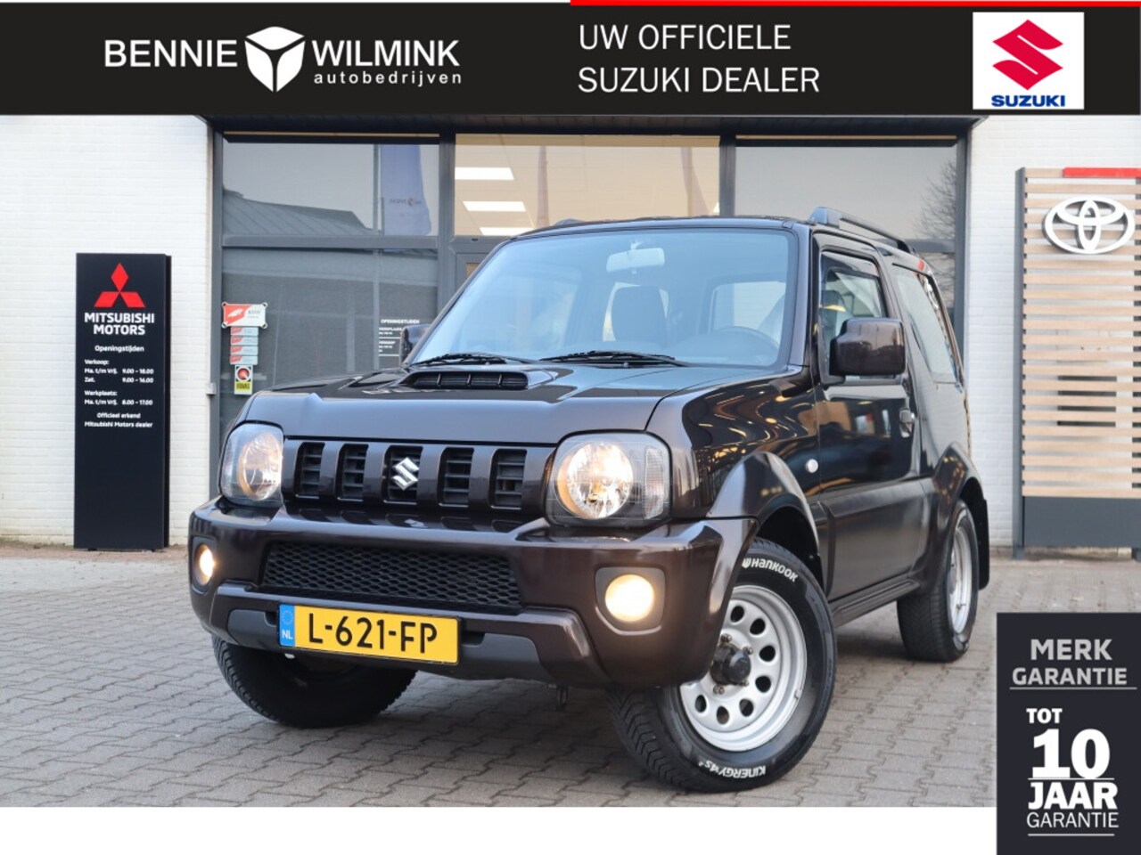 Suzuki Jimny - 1.3 Exclusive Automaat | 4X4 | Airco | Trekhaak - AutoWereld.nl