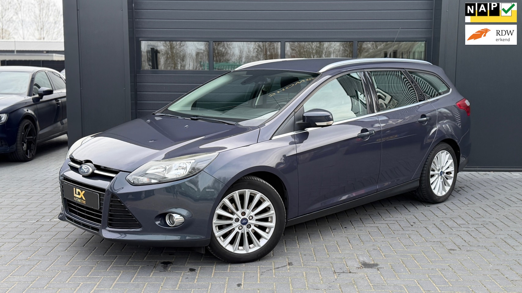 Ford Focus Wagon - 1.0 EcoBoost Titanium Airco|Navi|Trekhaak - AutoWereld.nl