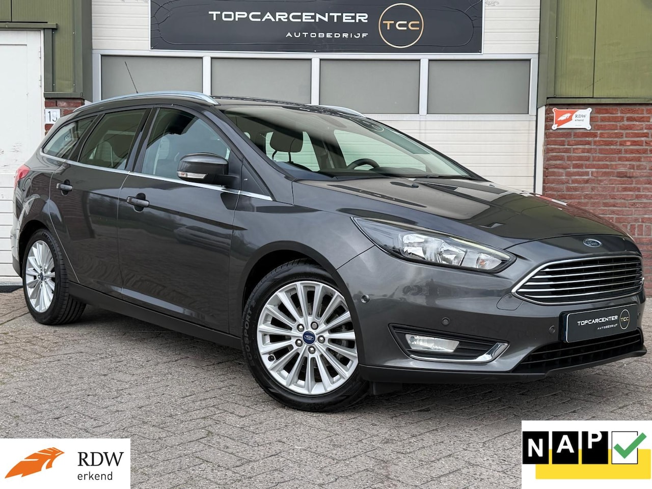 Ford Focus Wagon - 1.0 First/AIRCO/PARKS/NAVI/CRUISE/APK/NAP - AutoWereld.nl