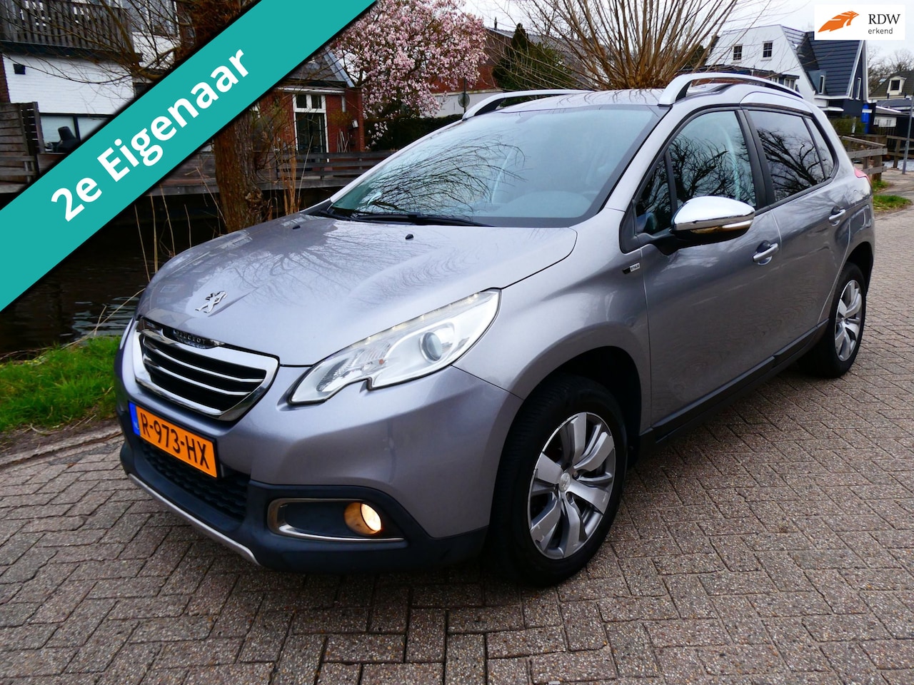Peugeot 2008 - 1.2i Active 132.000km. 2e eig. Clima Cruise Navi Trekhaak 1100kg. - AutoWereld.nl