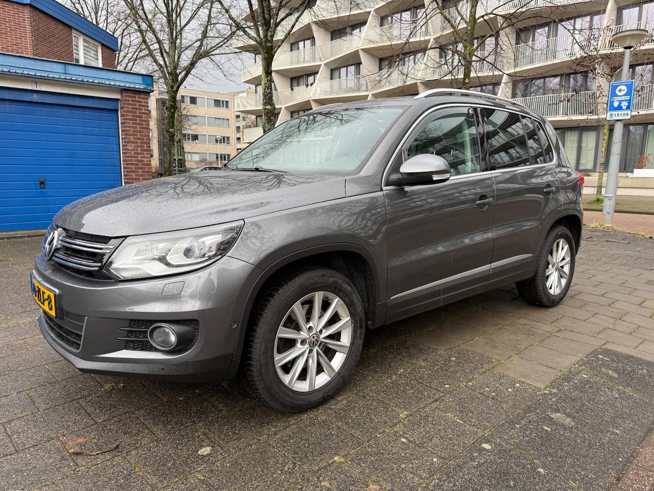 Volkswagen Tiguan - 1.4 TSI Sport&Style Panorama Parkassist Cruise - AutoWereld.nl