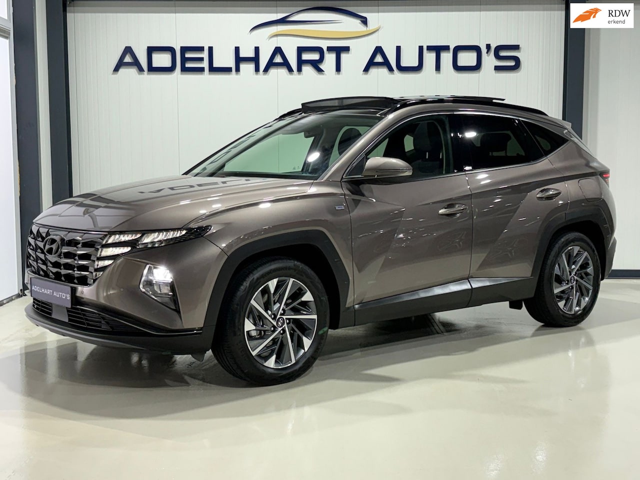 Hyundai Tucson - 1.6 T-GDI MHEV Comfort 4 wheel drive H track Automaat / Panorama dak / Navigatie full map - AutoWereld.nl