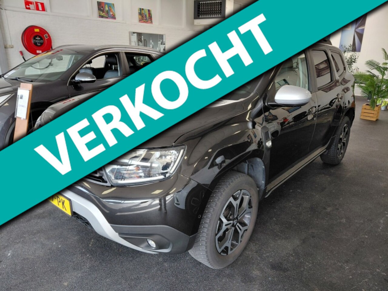 Dacia Duster - 1.3 TCe Tech Road 150pk | trekhaak | leder | 360 camera - AutoWereld.nl