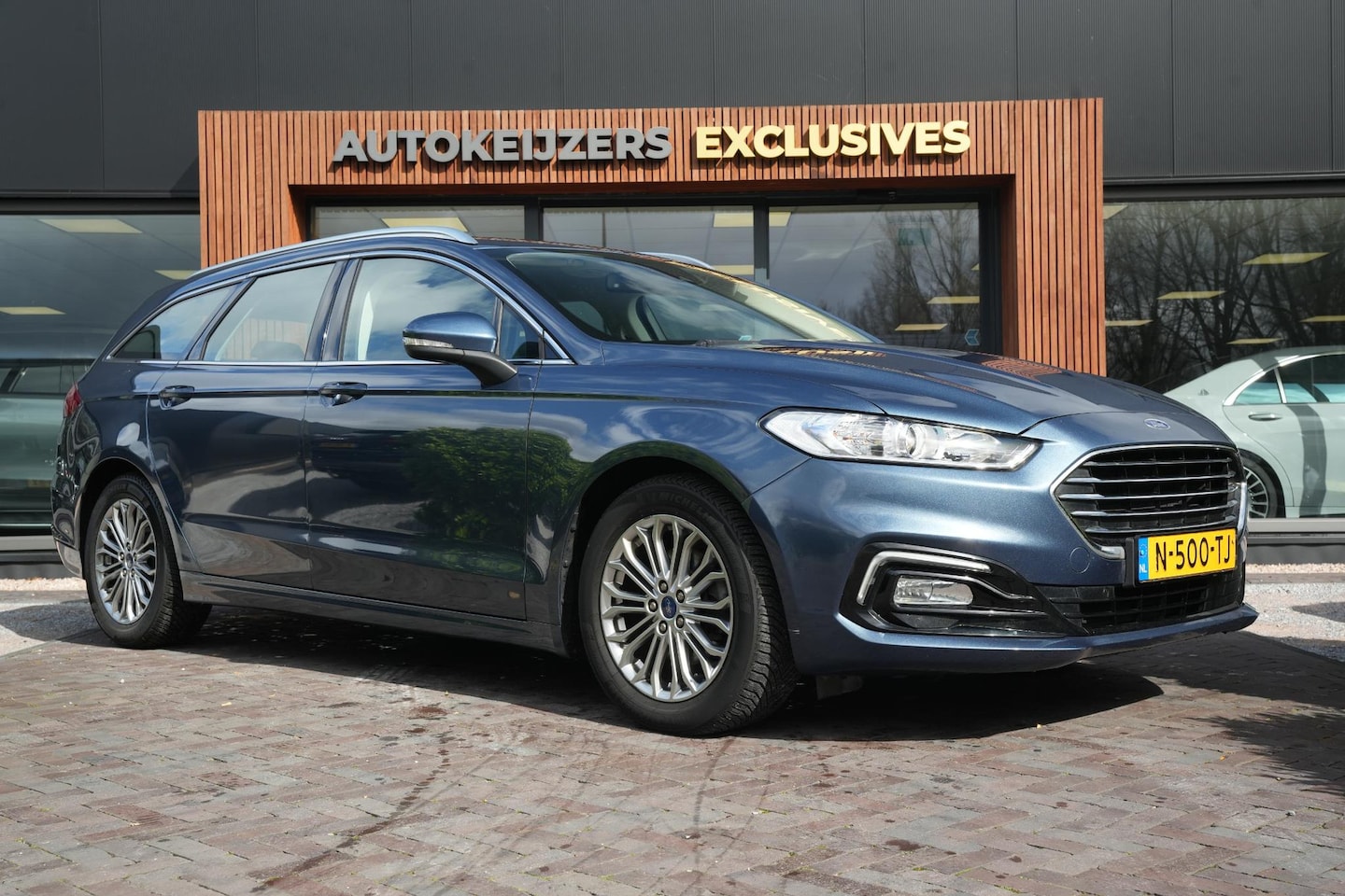 Ford Mondeo Wagon - 2.0 IVCT HEV Titanium Leer Stoelvent. Cruise Clima PDC - AutoWereld.nl