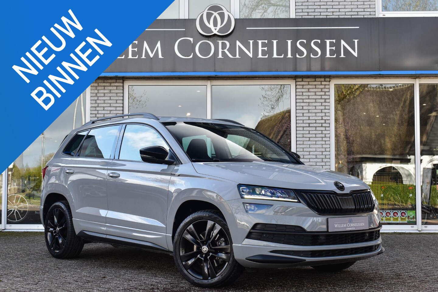 Skoda Karoq - 1.5 TSI ACT Sportline Business Trekhaak Navi Camer - AutoWereld.nl