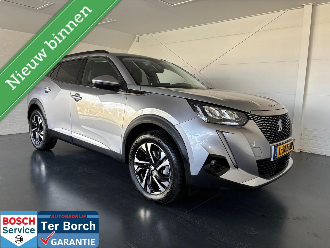 Peugeot e-2008 - EV Blue Lease Allure 50 kWh,Adap.cruise,Camera - AutoWereld.nl