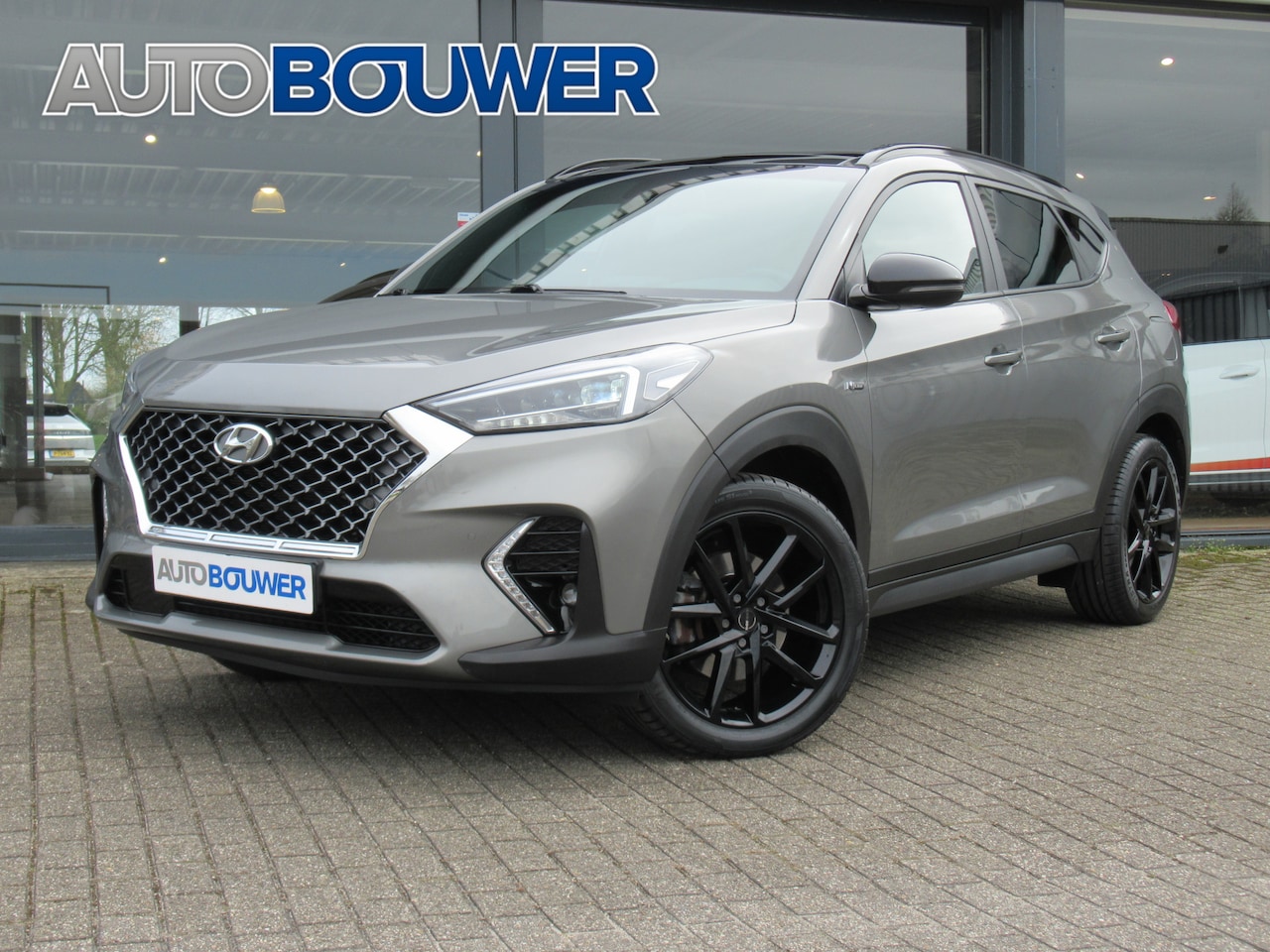 Hyundai Tucson - 1.6 T-GDI 177 PK 4WD N-Line 2e eigen | dealer onderh | panodak | full option! - AutoWereld.nl