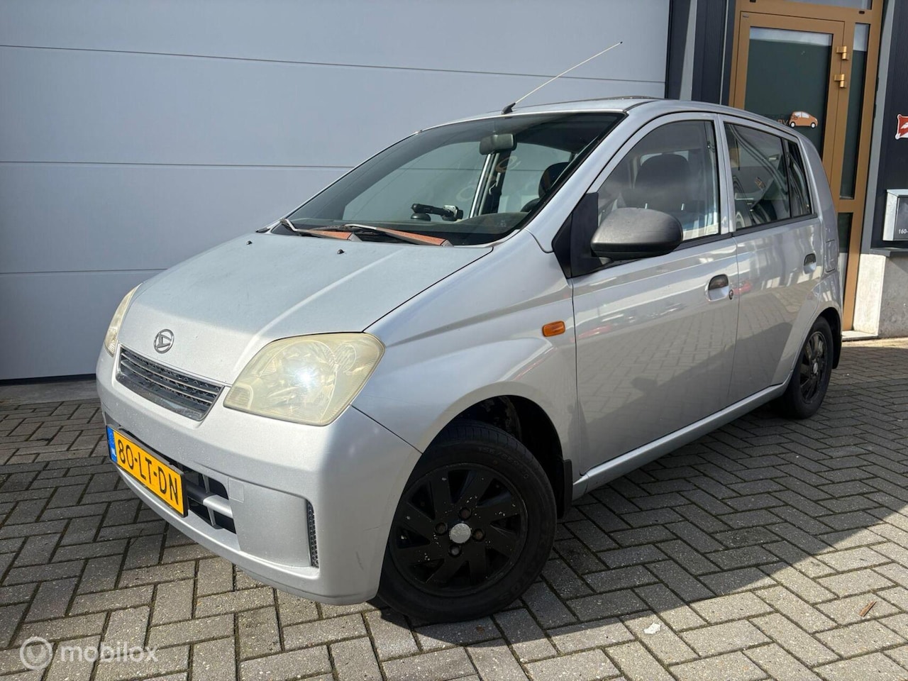 Daihatsu Cuore - 1.0-12V SchuifdakElektrPakketBluetoothCamera - AutoWereld.nl