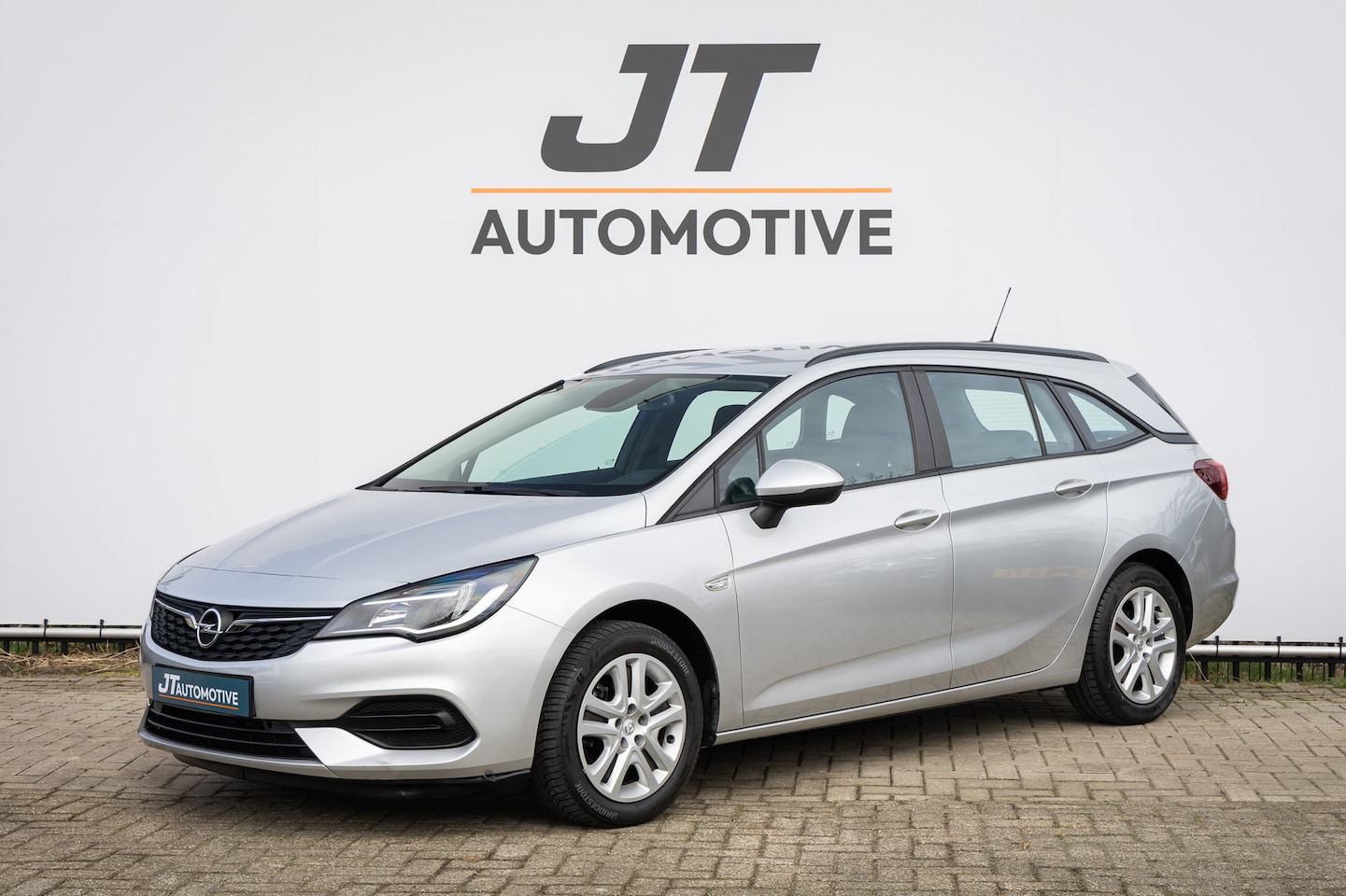 Opel Astra Sports Tourer - 1.4 Edition Cruise control | PDC | Voorruitverwarming | Navigatie | Carplay - AutoWereld.nl