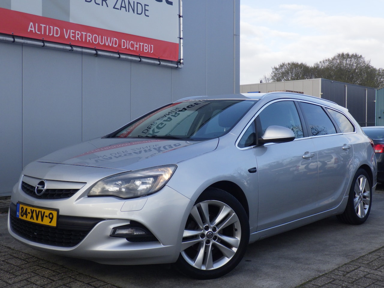 Opel Astra Sports Tourer - 1.4 Turbo Sport 1.4 Turbo Sport, Airco, Cruise, Trekhaak! - AutoWereld.nl