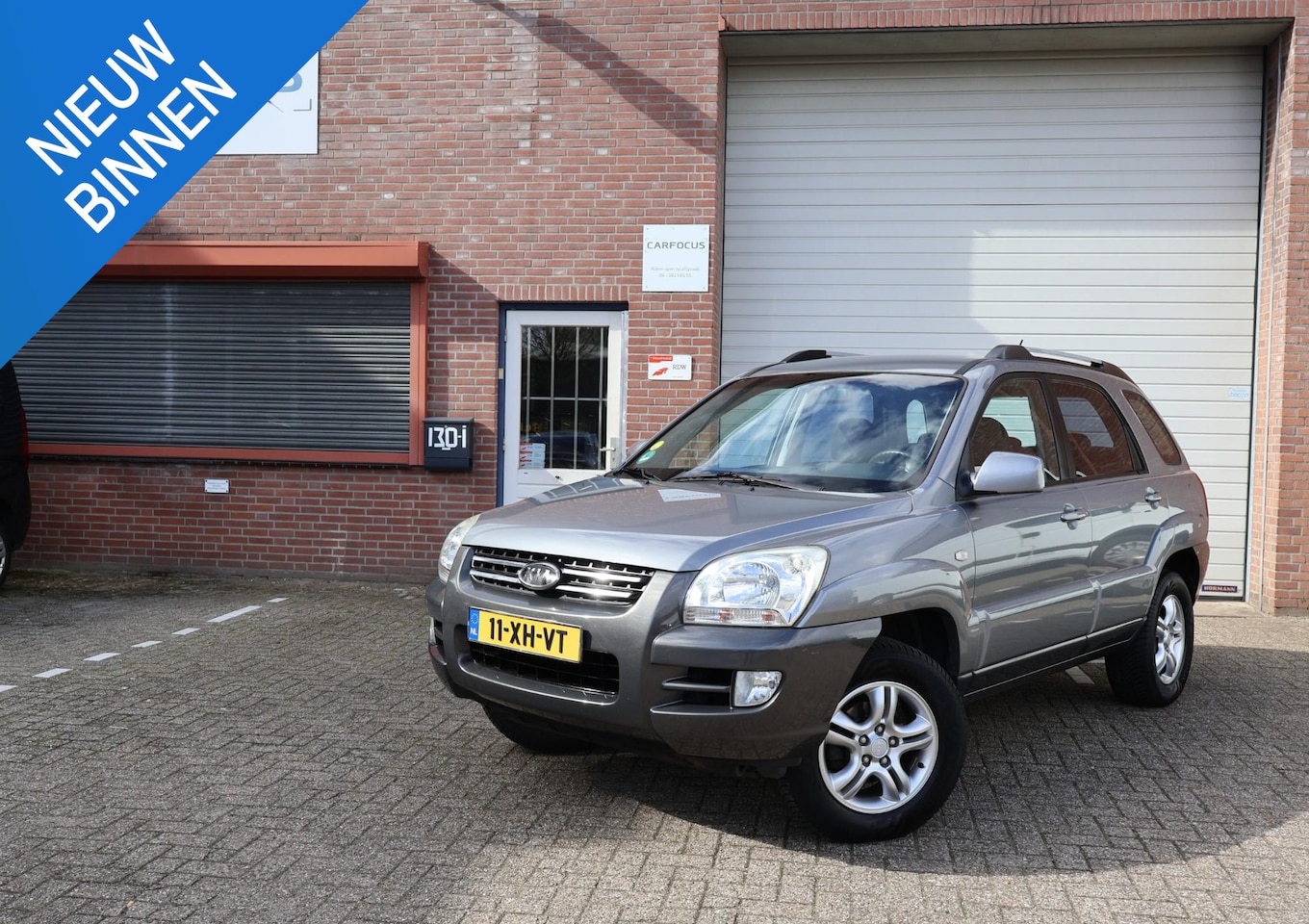 Kia Sportage - 2.0 CVVT Comfort 2e eigenaar NAP Trekhaak Airco Cruise APK - AutoWereld.nl