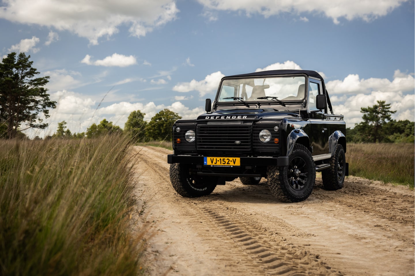 Land Rover Defender - 2.2Tdci Soft Top Recaro stoelen 25.000km. - AutoWereld.nl