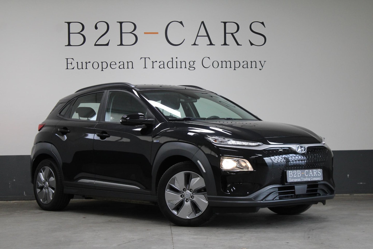 Hyundai Kona Electric - EV Premium 64 kWh SOH 100% - Trekhaak - AutoWereld.nl