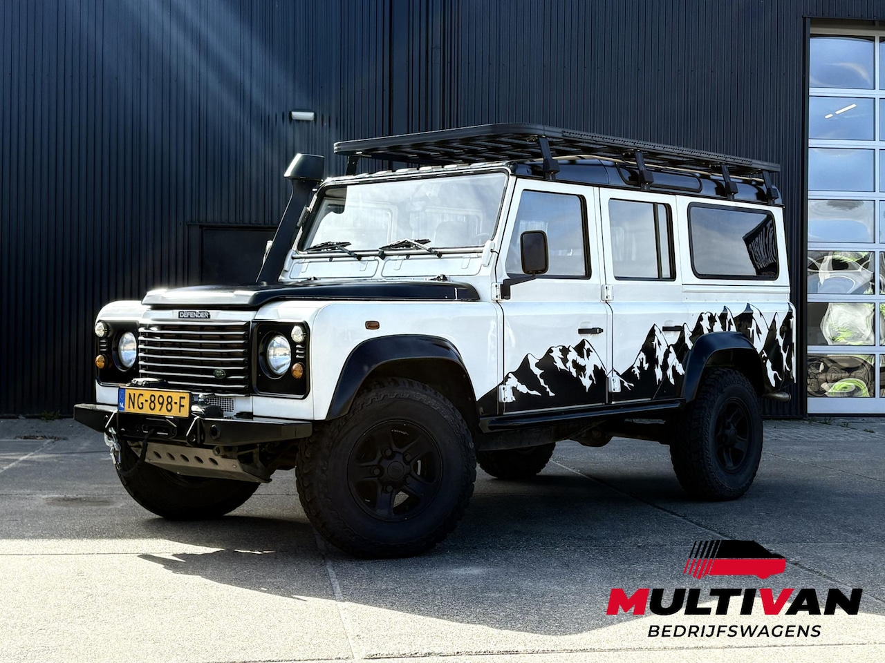 Land Rover Defender 110 - 2.5 TD5 SAFARI | GRIJS KENTEKEN 2P | LIER | LUXE STOEL | SNORKEL | DAKTENT FEMKES | RVS UI - AutoWereld.nl