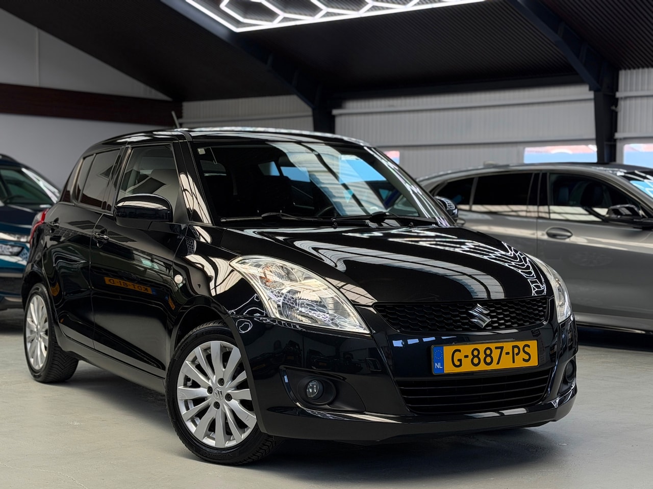 Suzuki Swift - 1.2 Comfort CarPlay Airco - AutoWereld.nl