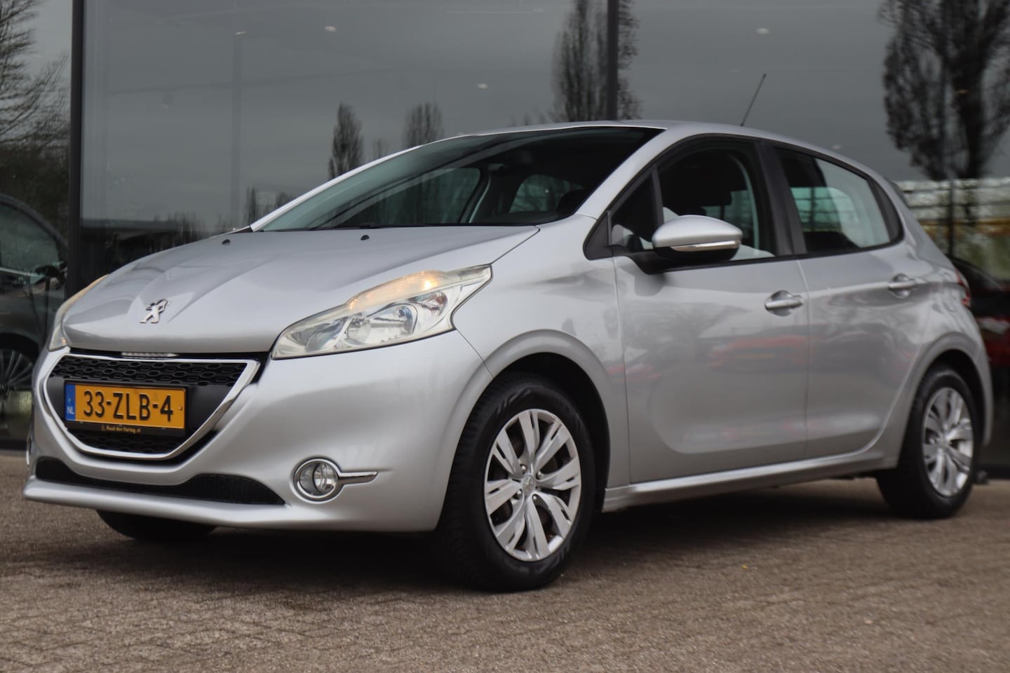 Peugeot 208 - 1.2 VTi ENVY 5-DRS. | CLIMATE | BLUETOOTH | CRUISE | PDC | NAVI | NAP - AutoWereld.nl