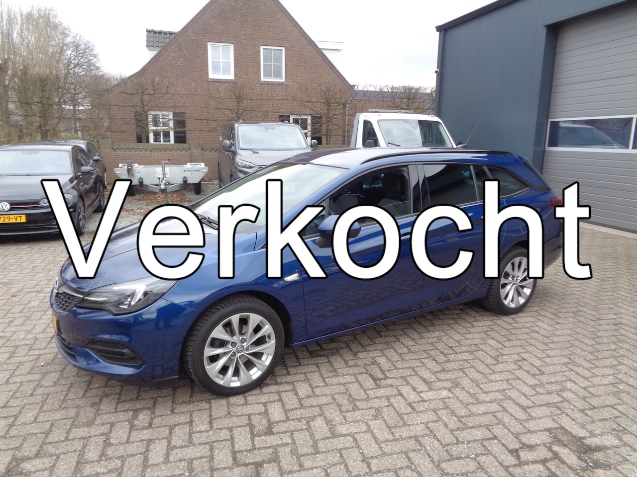 Opel Astra Sports Tourer - 1.2 Business Elegance Ecc, Cruise, Navigatie, PDC v+a, carplay, half leer - AutoWereld.nl