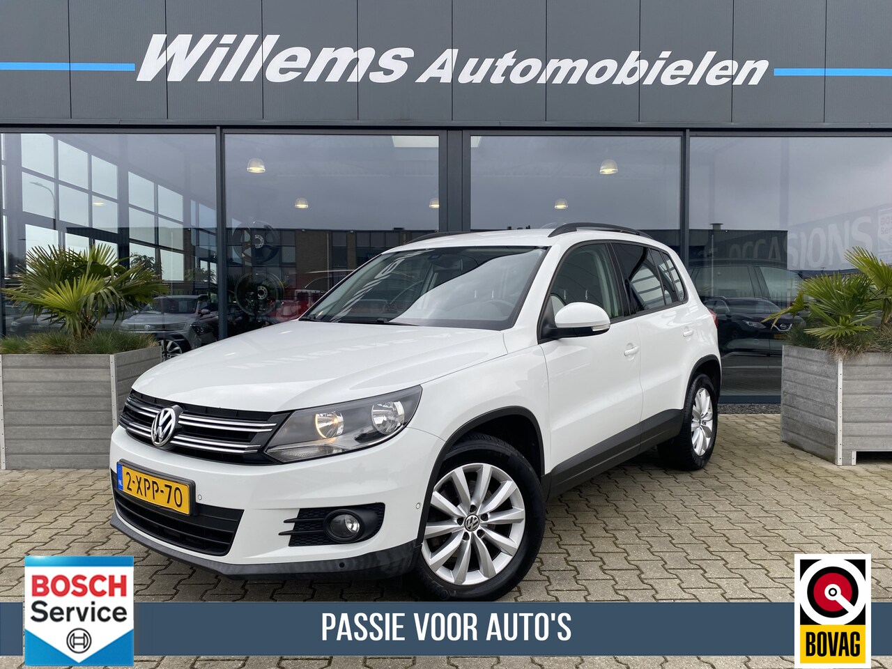 Volkswagen Tiguan - 1.4 TSI Comfort&Design Edition Trekhaak Wegkklapbaar, Navigatie & Cruise Control - AutoWereld.nl