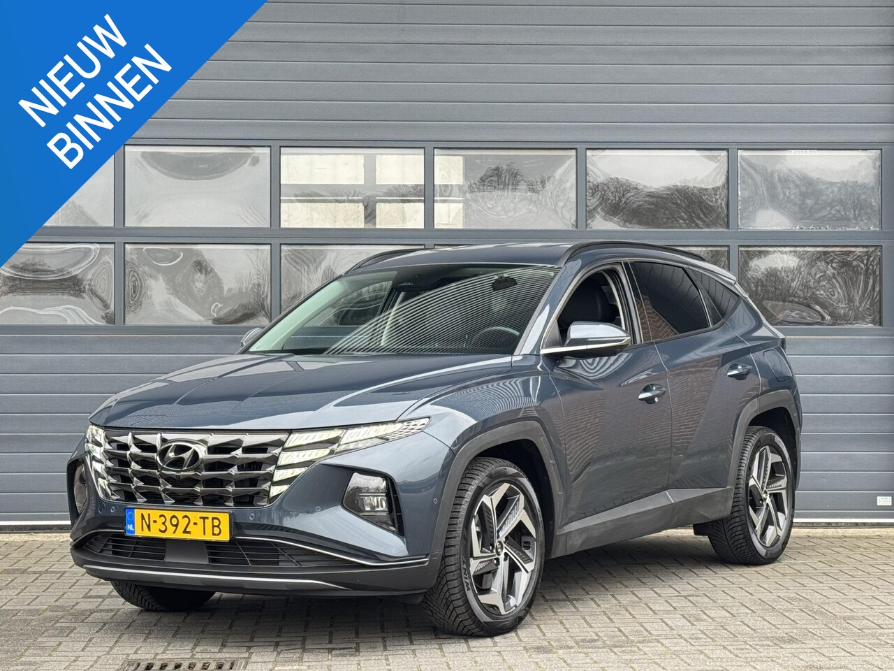 Hyundai Tucson - 1.6 T-GDI HEV PREMIUM I 2E PAASDAG OPEN I AUTOMAAT I TREKHAAK I APPLE CARPLAY I LEDEREN BE - AutoWereld.nl