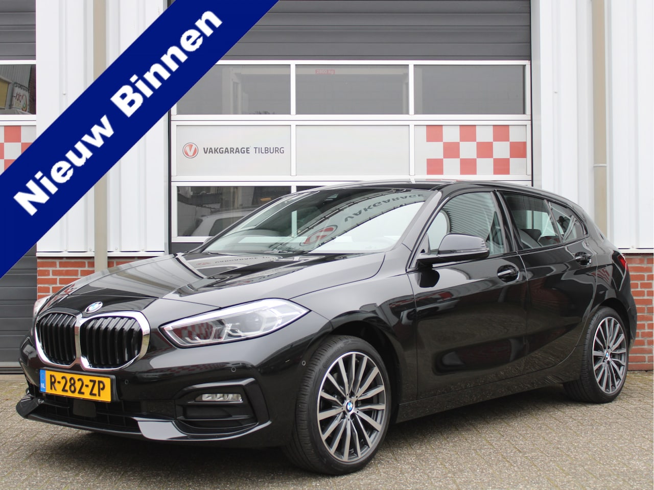 BMW 1-serie - 118i Business+ Sport Automaat /Navigatie/Camera/Leder/Stoelverwarming/PDC/18'LM/LED/Lane a - AutoWereld.nl