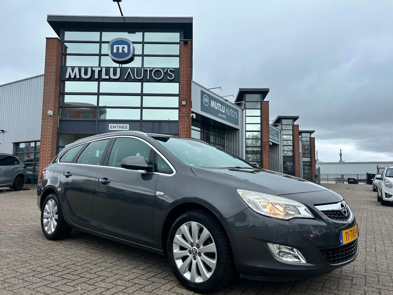 Opel Astra Sports Tourer - 1.4 Turbo Cosmo Airco NAP PDC NAVI APK - AutoWereld.nl