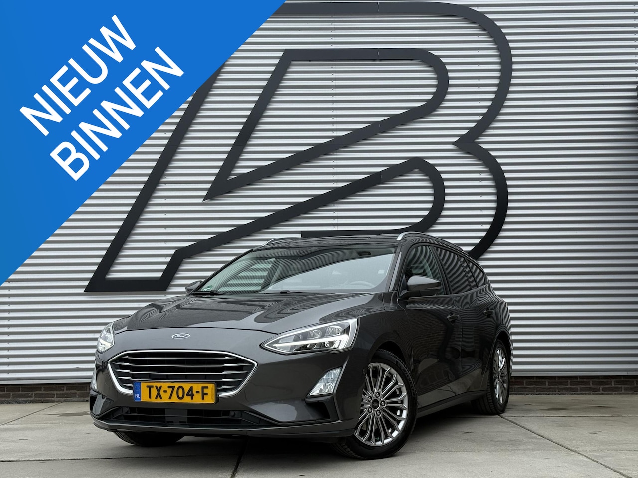 Ford Focus Wagon - 1.0 EcoBoost Titanium Business 2e Eigenaar|Navi|Trekhaak|Camera|B&O Sound System|Clima|Cru - AutoWereld.nl