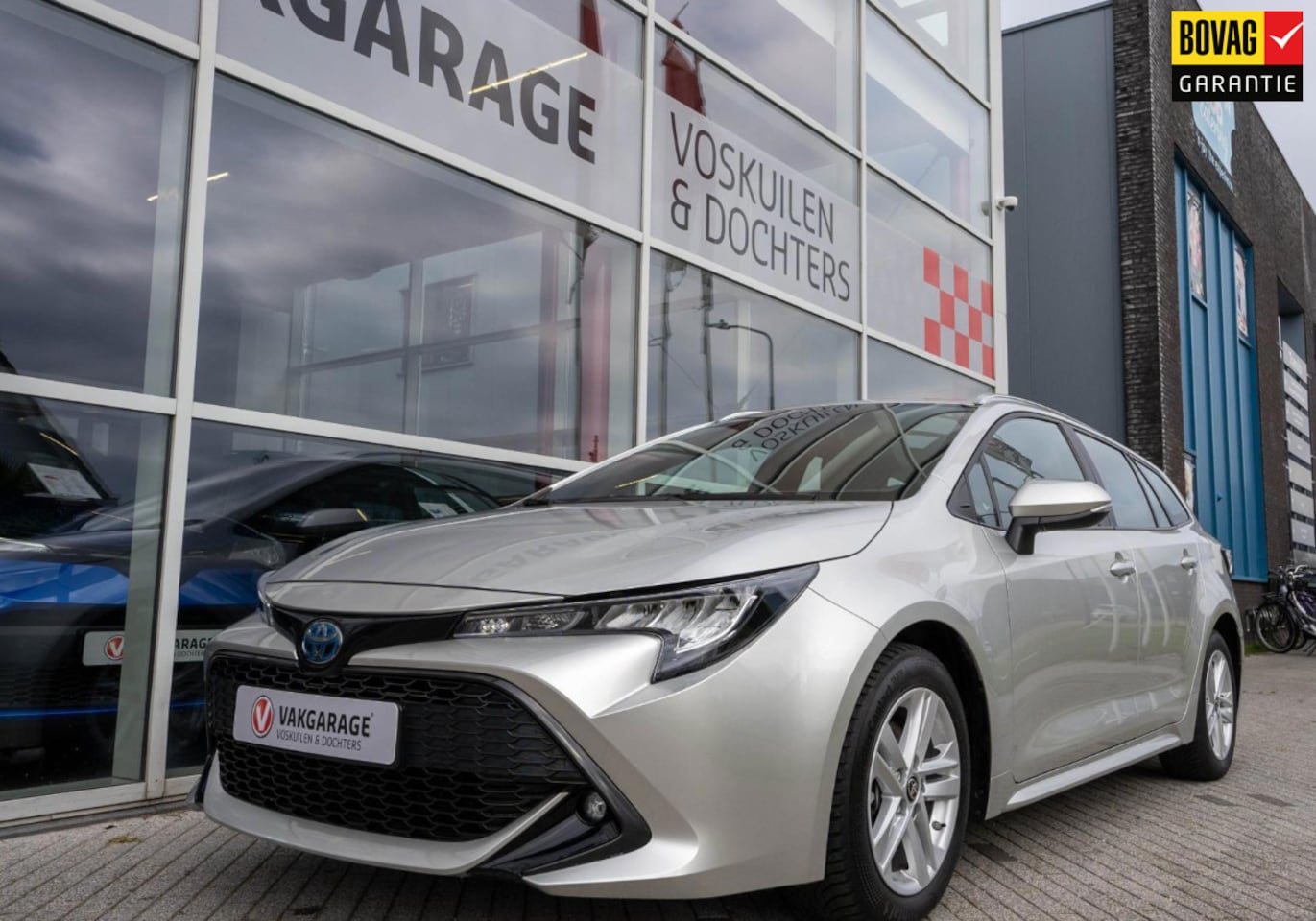 Toyota Corolla Touring Sports - 1.8 Hybrid Business | Stoelverwarming | Navigatie | Camera - AutoWereld.nl