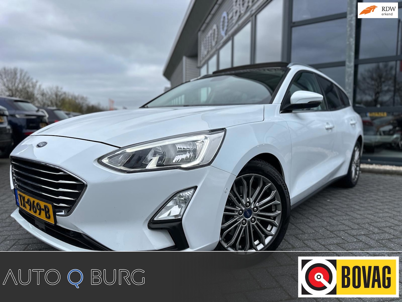 Ford Focus Wagon - 1.0 EcoBoost Titanium Business | Trekhaak | Stoel/Stuur Verwarming | Pano | Camera | Navi - AutoWereld.nl