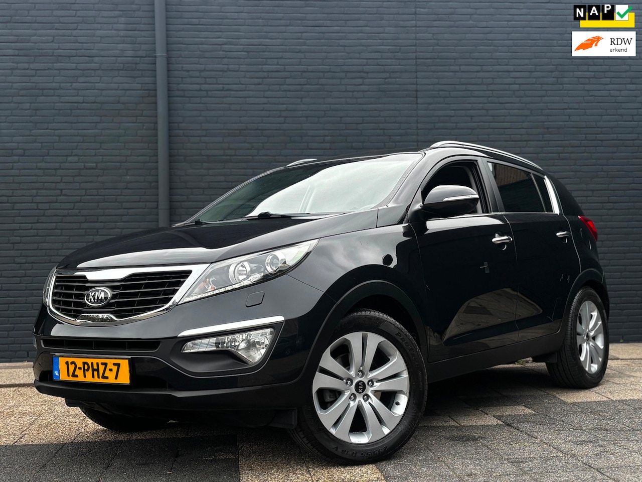 Kia Sportage - 2.0 X-clusive | Navi | Camera | Trekhaak | NAP - AutoWereld.nl