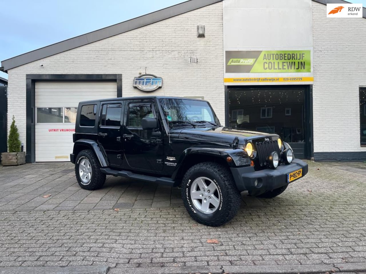 Jeep Wrangler Unlimited - 3.8 Sahara Zwart - AutoWereld.nl