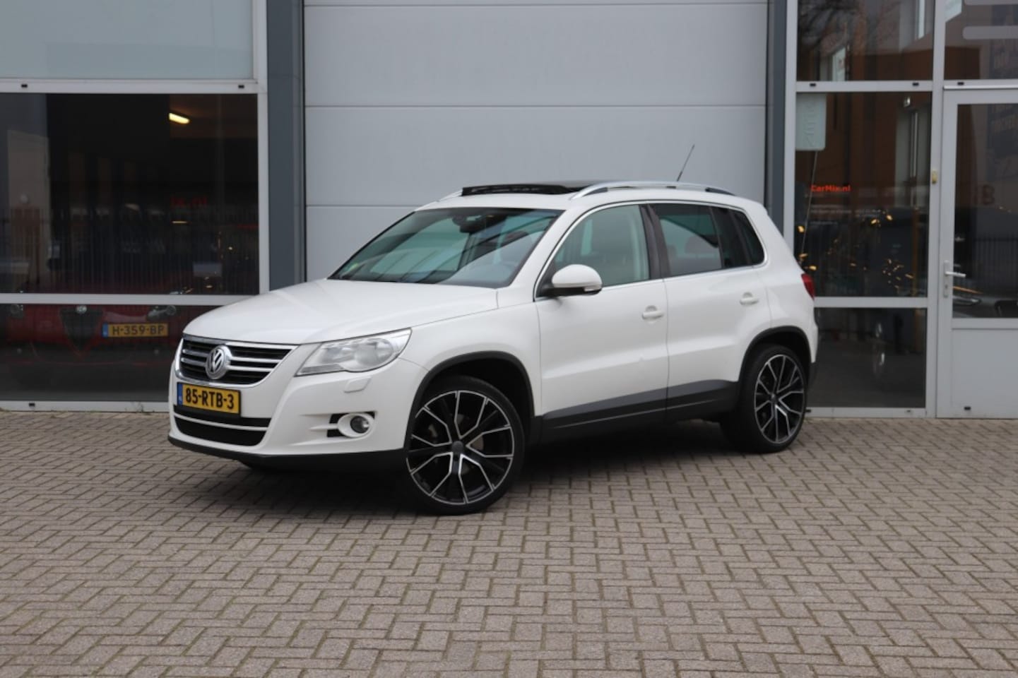Volkswagen Tiguan - 2.0 TSI SPORTenST.4M - AutoWereld.nl