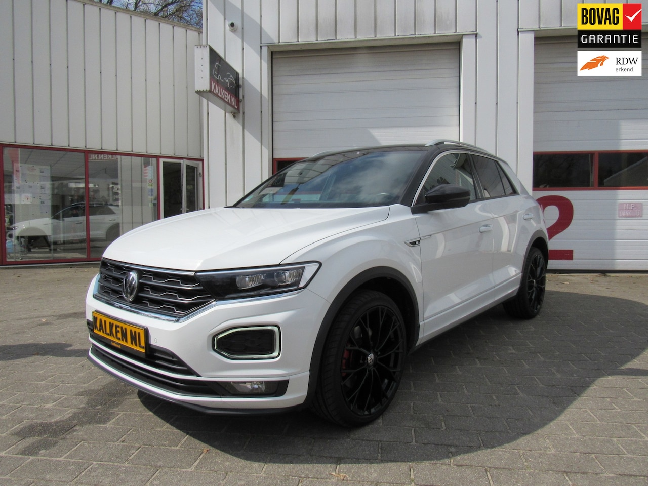 Volkswagen T-Roc - 1.5 TSI Sport Business R STYLE CAMERA/ACC/NAVI/CAR - AutoWereld.nl