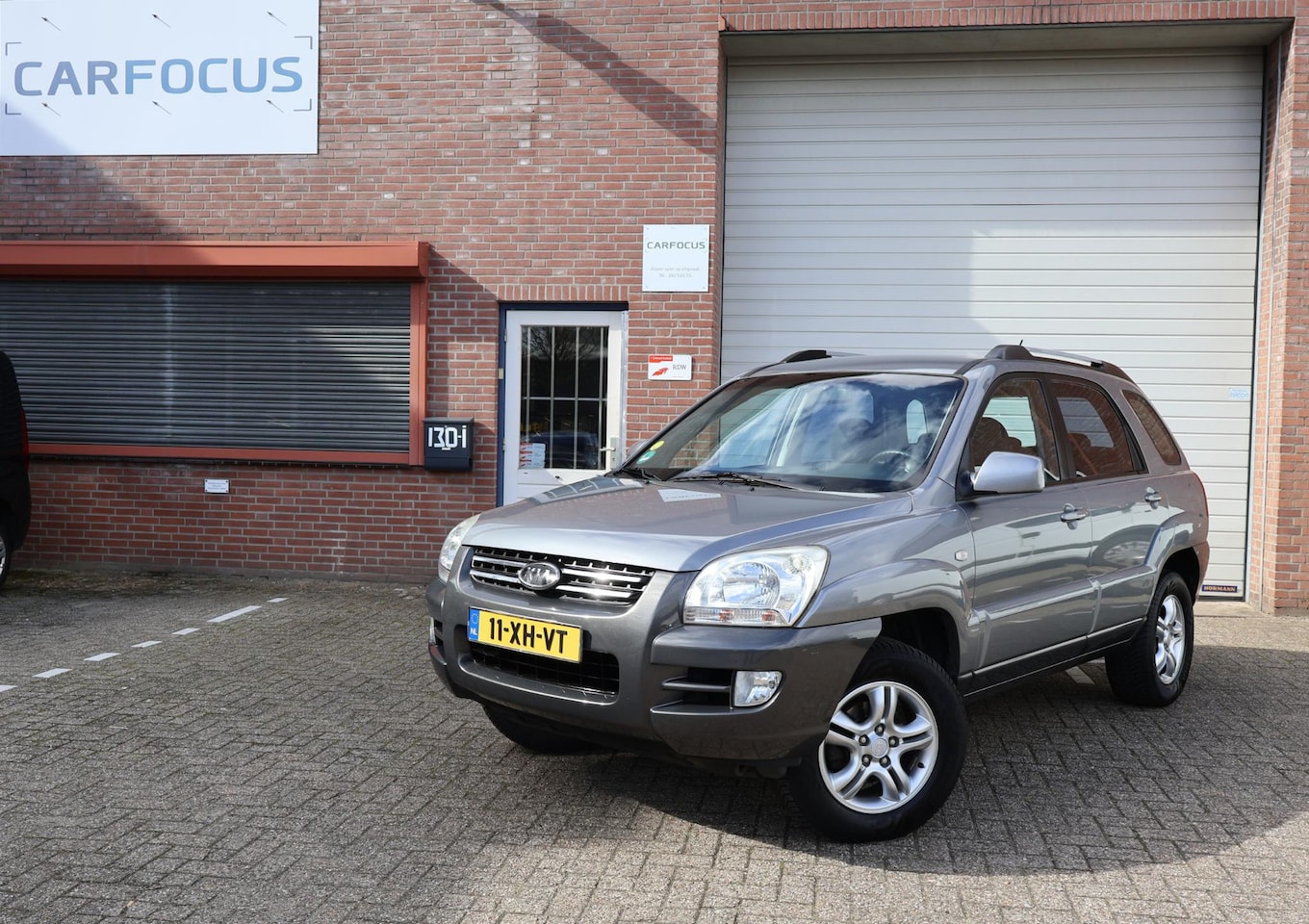 Kia Sportage - 2.0 CVVT Comfort NAP Trekhaak Airco Cruise APK - AutoWereld.nl
