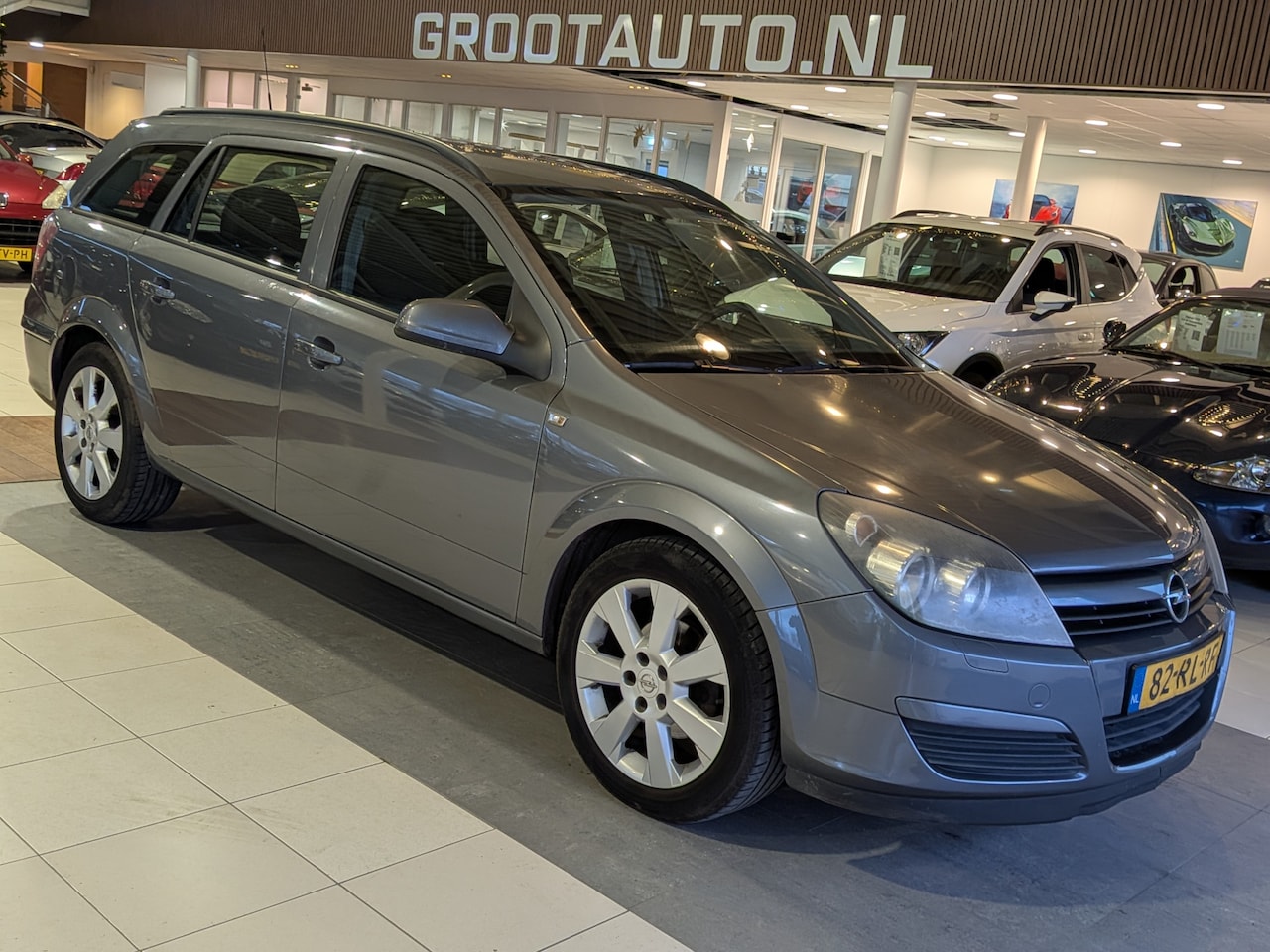 Opel Astra Wagon - 1.6 Enjoy Airco, Cruise Control, Trekhaak, Stuurbekrachtiging - AutoWereld.nl