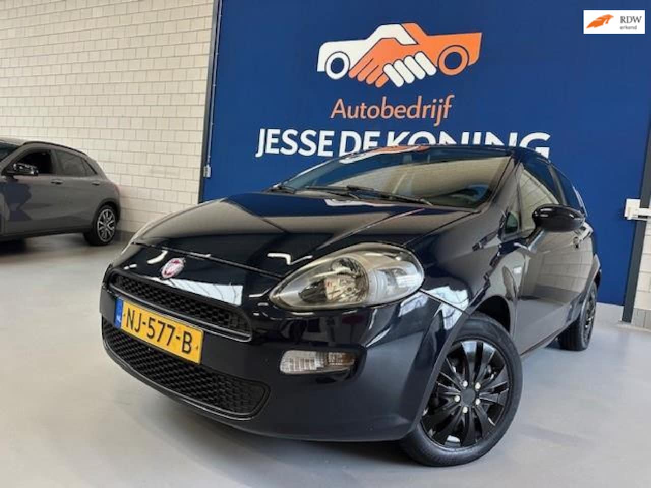 Fiat Punto Evo - 1.2 Pop /bj.2013 / kleur: blauw / airco / scherm / navigatie/ NAP met 152343 km.en APK tot - AutoWereld.nl