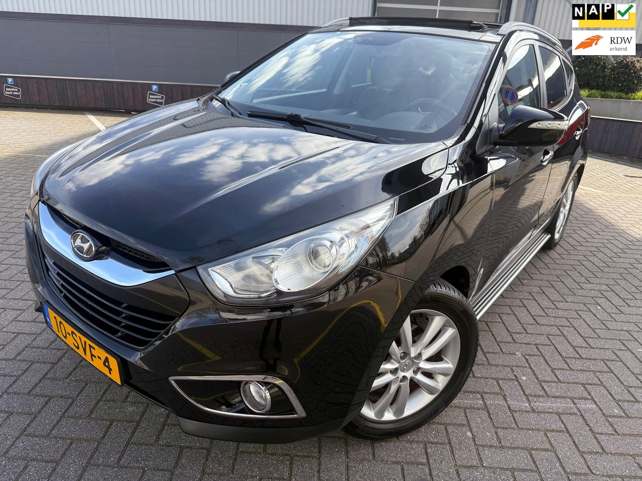 Hyundai ix35 - 2.0i i-Catcher*CRUISE*NAVI*PARK SENSOREN*AIRCO*LEER BEKLEDING*STOEL VERWARMING - AutoWereld.nl
