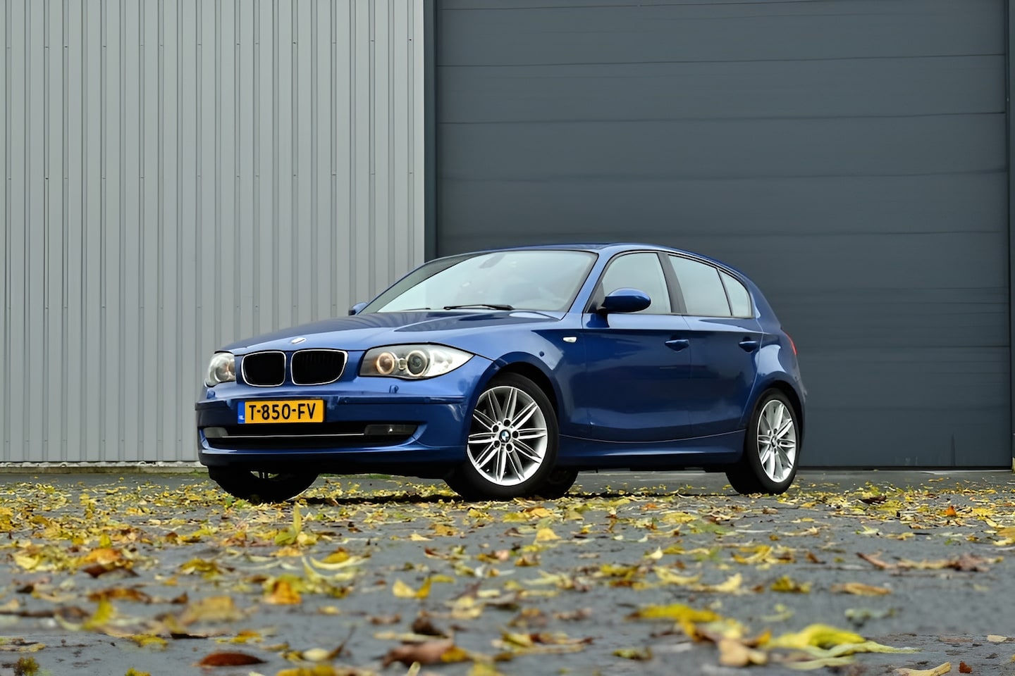 BMW 1-serie - 116i High Executive | Montego Blue | Xenon | Cruise en Climate Control - AutoWereld.nl