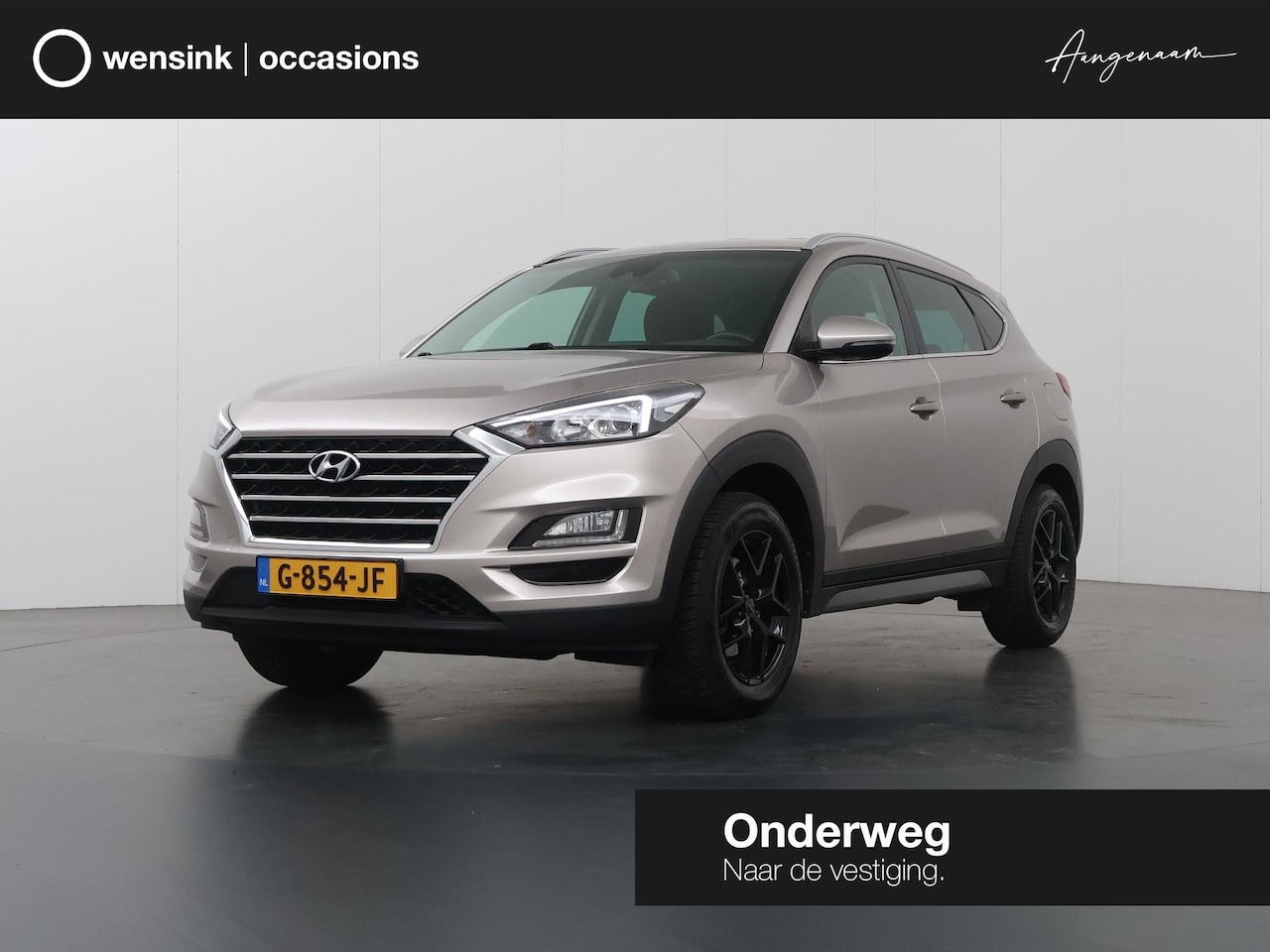 Hyundai Tucson - 1.6 GDI Comfort | Trekhaak | Navigatie | Climate Control | Cruise Control | Parkeercamera - AutoWereld.nl