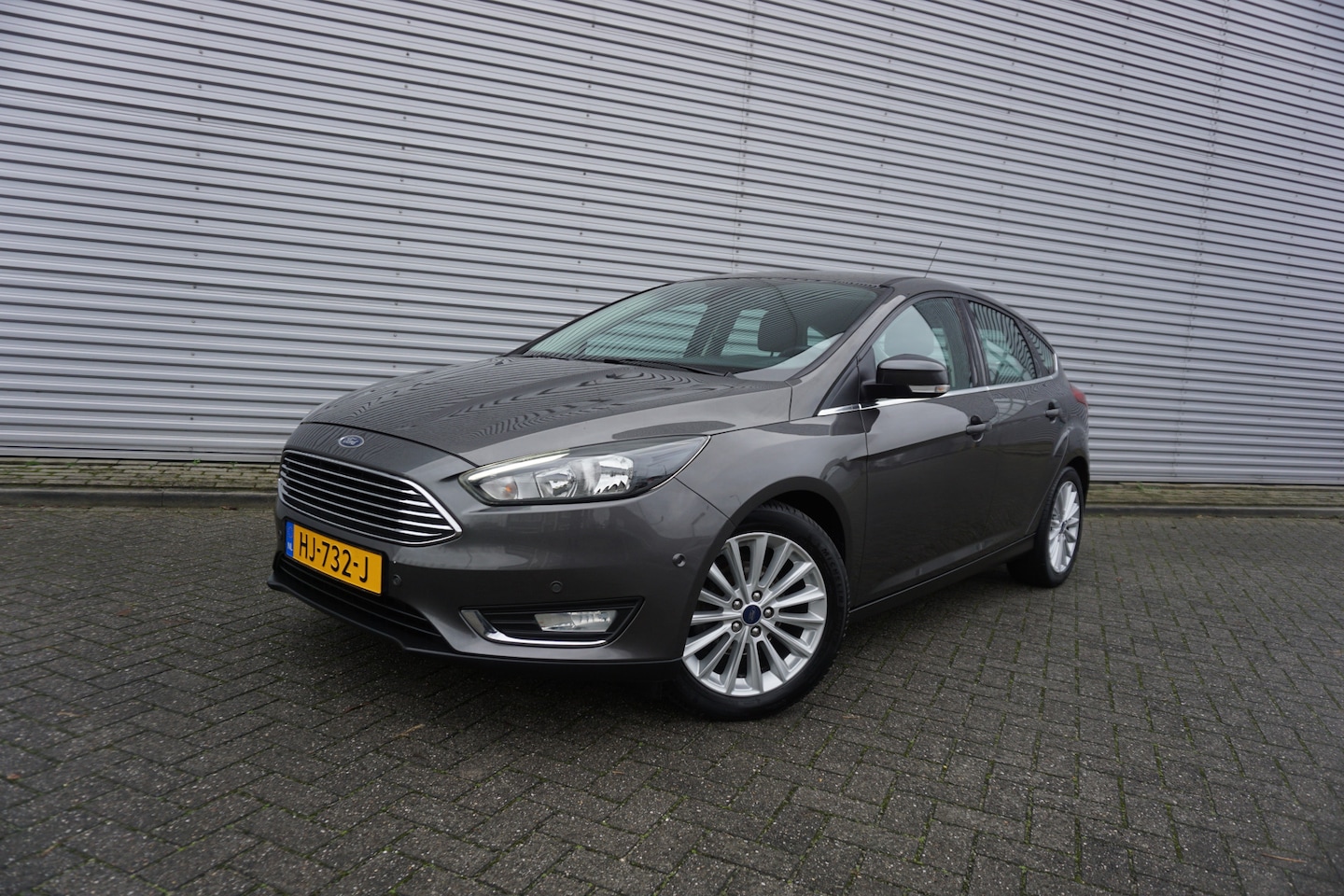 Ford Focus - 1.0 Titanium Edition 1e Eigenaar / Navi / Climate controle / Cruise / Lm velgen - AutoWereld.nl
