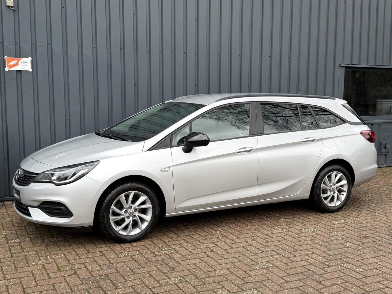 Opel Astra Sports Tourer - 1.2 Ultimate 1E EIG.!/DEALER OND.!/145 PK!/APK!/ - AutoWereld.nl