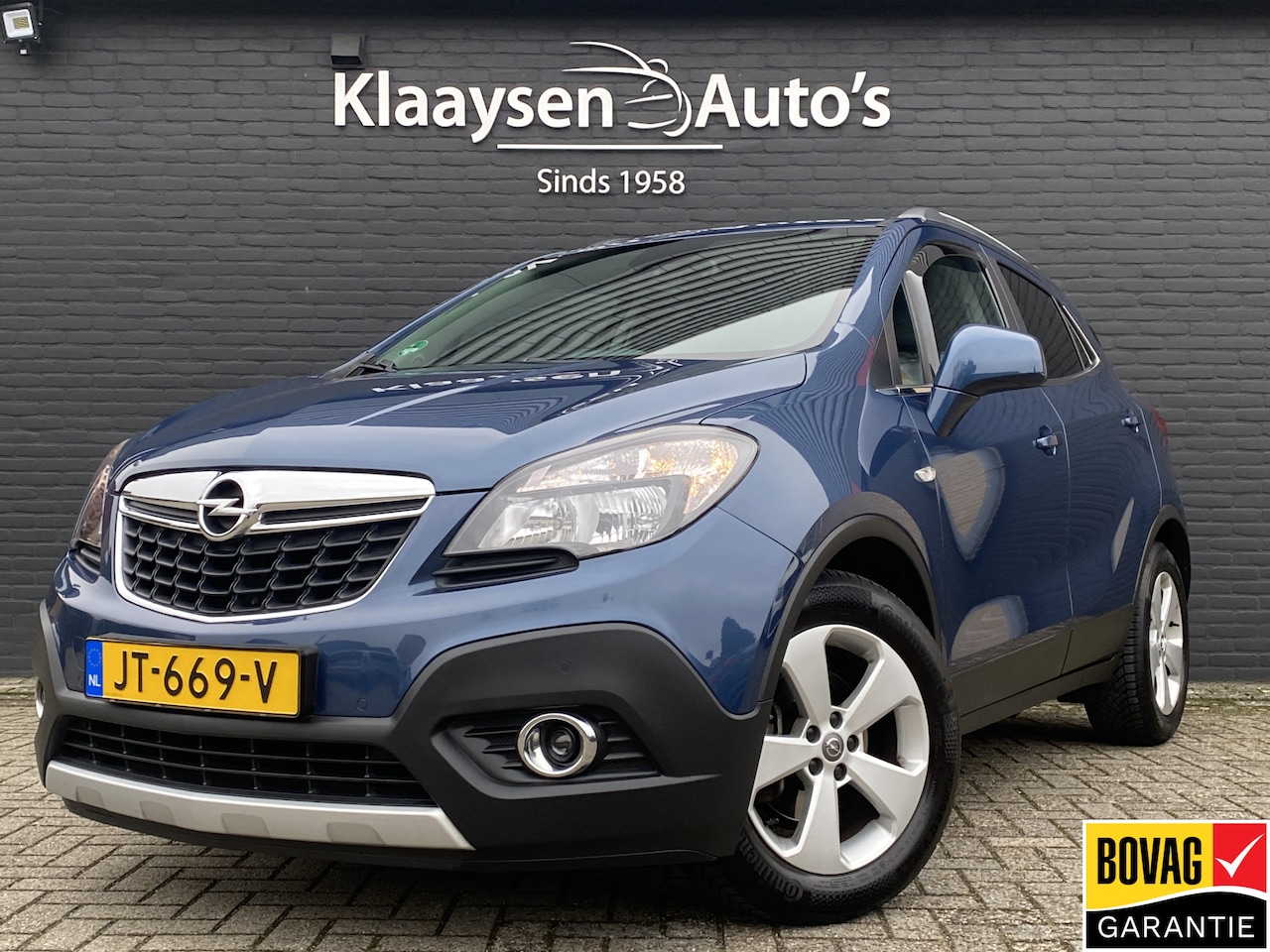 Opel Mokka - 1.4 T Cosmo 140 pk AUT. | dealer onderhouden | leder sportstoelen | navigatie | schuifdak - AutoWereld.nl