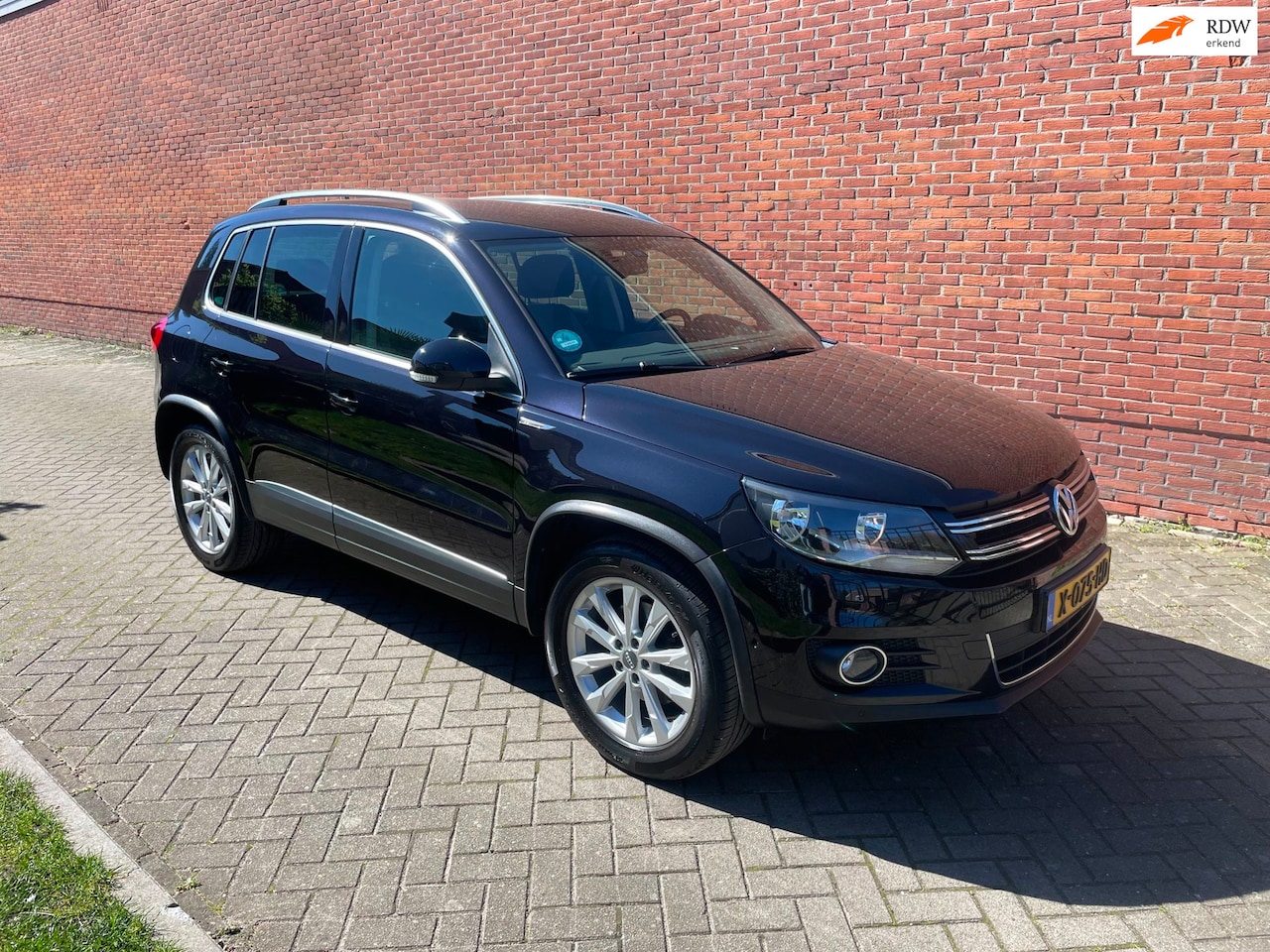Volkswagen Tiguan - 1.4 TSI Sport&Style Stoelverw Cruise PDC - AutoWereld.nl