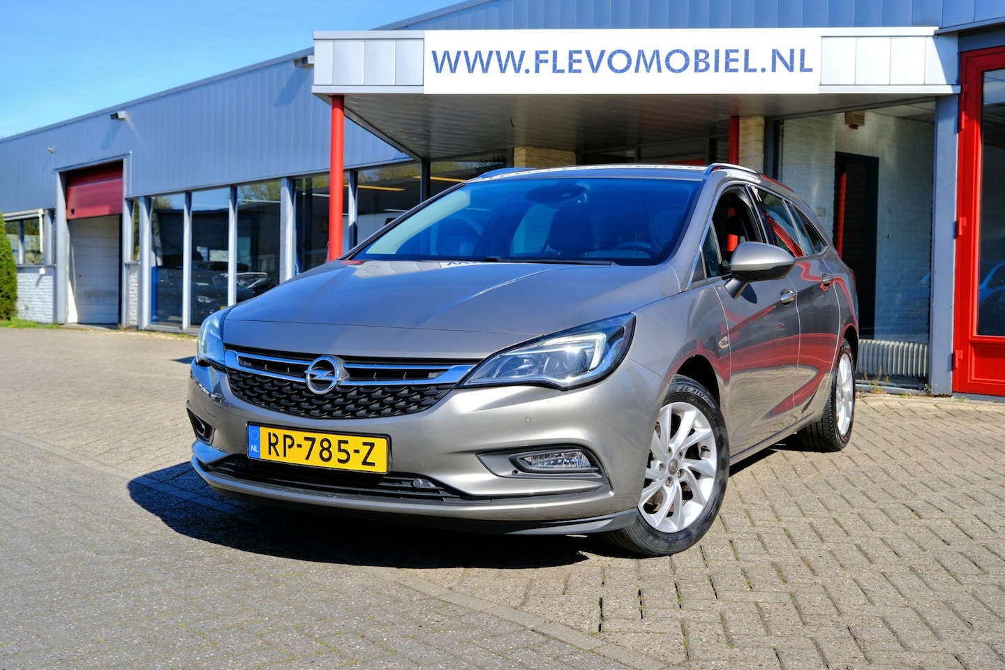 Opel Astra Sports Tourer - 1.4 150pk Innovation Navi|Half Leder|Cam|CarPlay|LMV - AutoWereld.nl