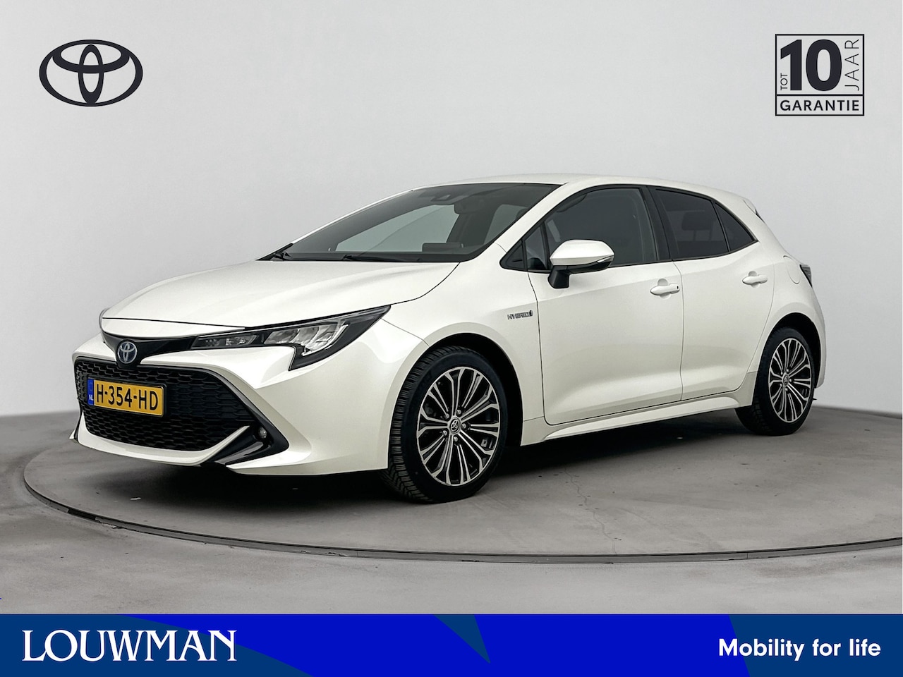 Toyota Corolla - 1.8 Hybrid Dynamic Style | Stoelverwarming | Parkeercamera | Apple Carplay / Android Auto - AutoWereld.nl