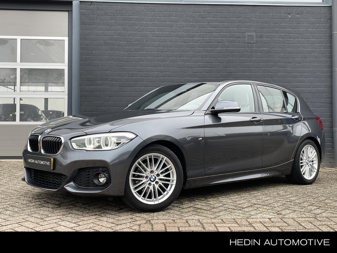 BMW 1-serie - 118i High Executive M-Pakket | Lederen Sportstoelen | Navigatie | Stoelverwarming | Cruise - AutoWereld.nl