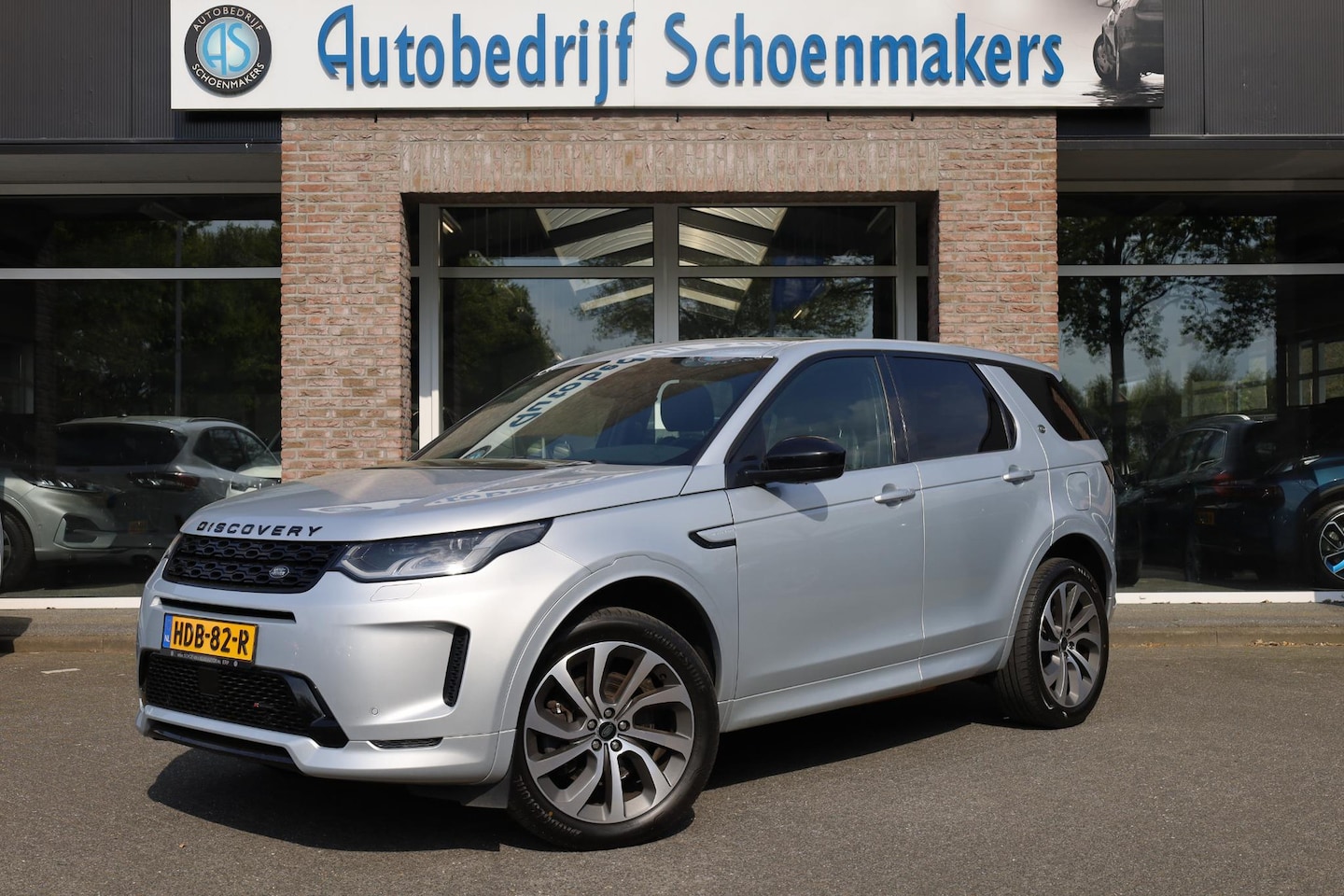 Land Rover Discovery Sport - P300e 1.5 R-Dynamic PANO WINDSOR-LEER MEMORY ELEK.TREKHAAK 20"LMV CAMERA RUITVERWARMING ME - AutoWereld.nl
