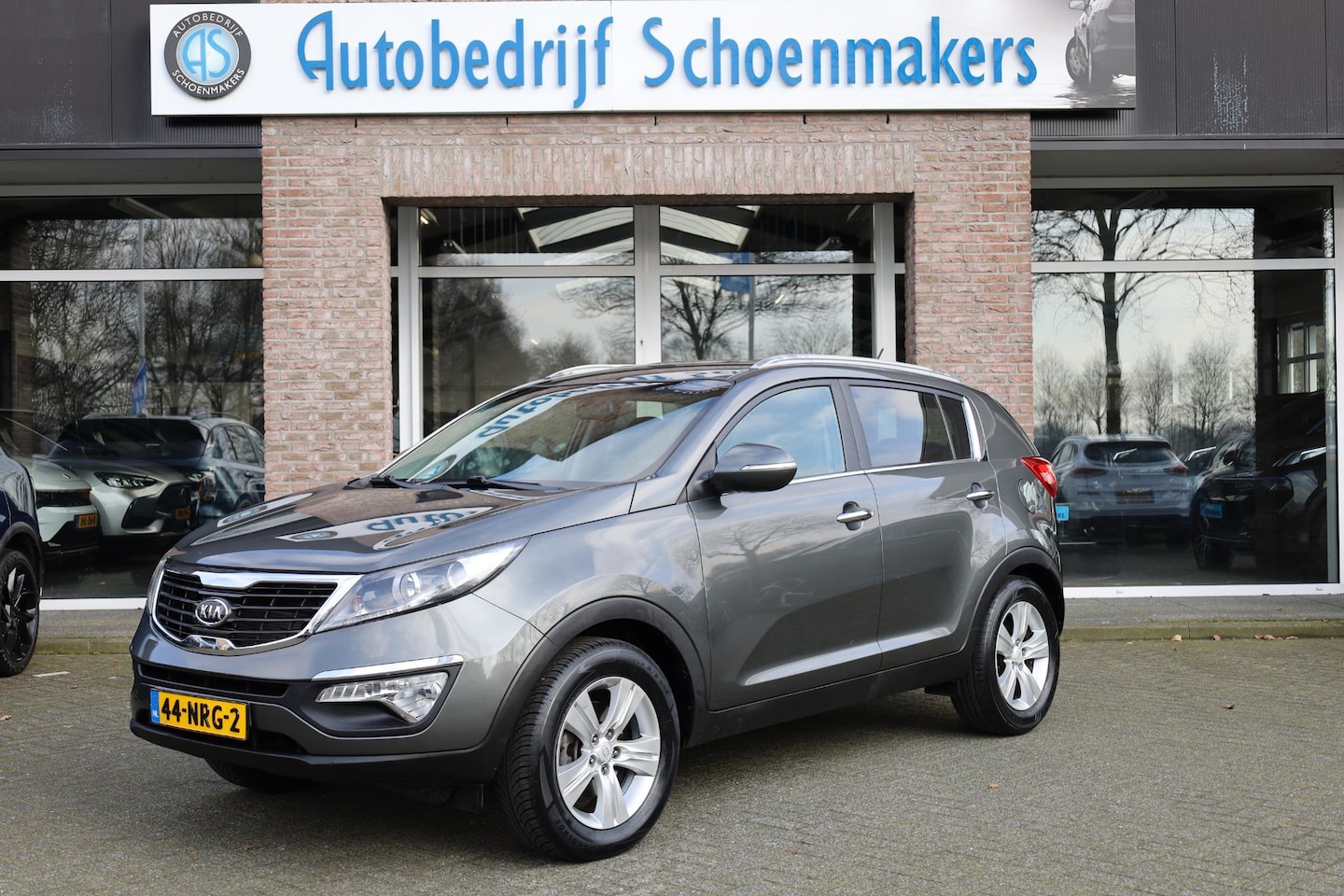 Kia Sportage - 2.0 X-ecutive Plus Pack HALF-LEER CRUISE NAVI CLIMA HILL-HOLD BT-TELEFOONVERB PDC 17''LMV - AutoWereld.nl