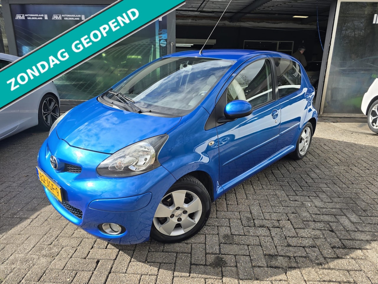 Toyota Aygo - 1.0-12V Dynamic Blue | 2E EIGENAAR | 12MND GARANTIE | ANDROID | AIRCO | ELEC RAMEN | LMV | - AutoWereld.nl