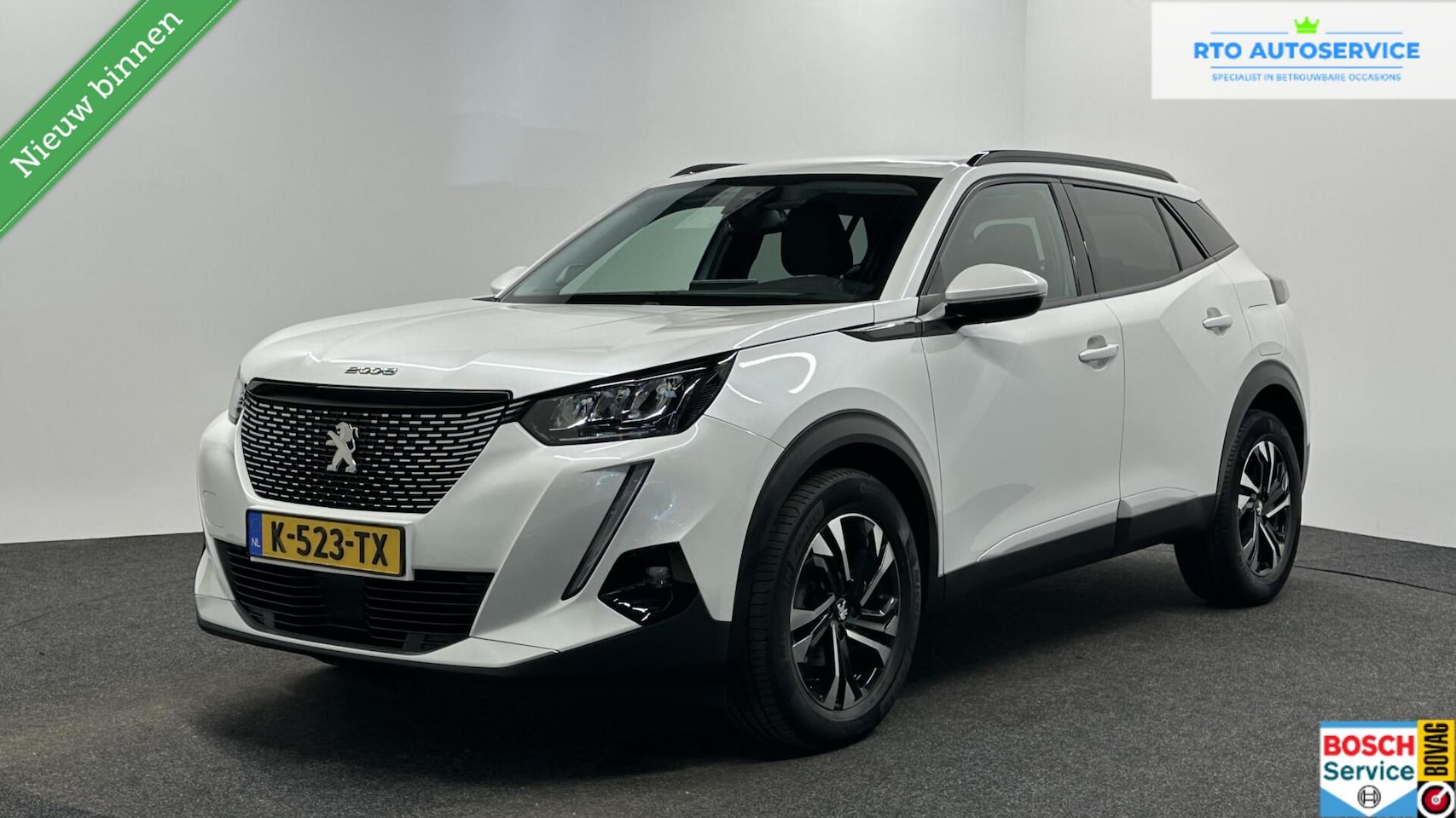 Peugeot 2008 - 1.2 PureTech Blue Lease Allure CAMERA CARPLAY NAVI ECC CRUISE. - AutoWereld.nl